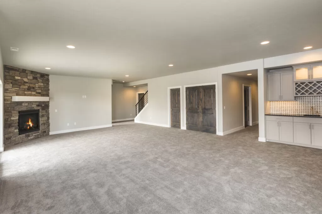 a remodeled basement with a wide open floorplan