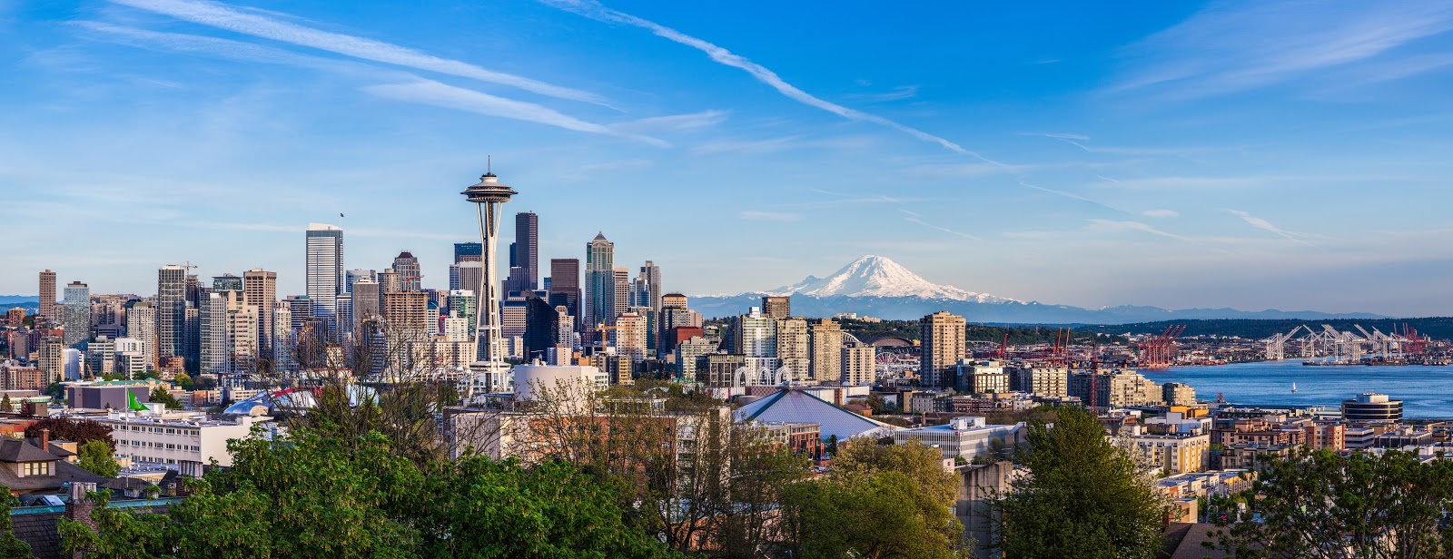 Panorama view of Seattle downtown skyline and Mt. Rainier, Washington.