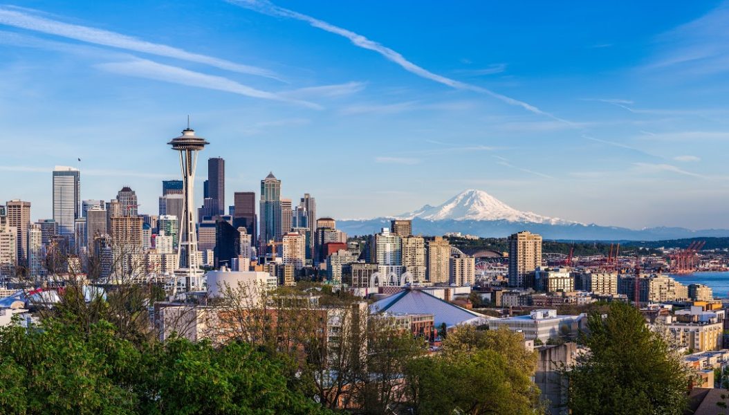 Panorama view of Seattle downtown skyline and Mt. Rainier, Washington.