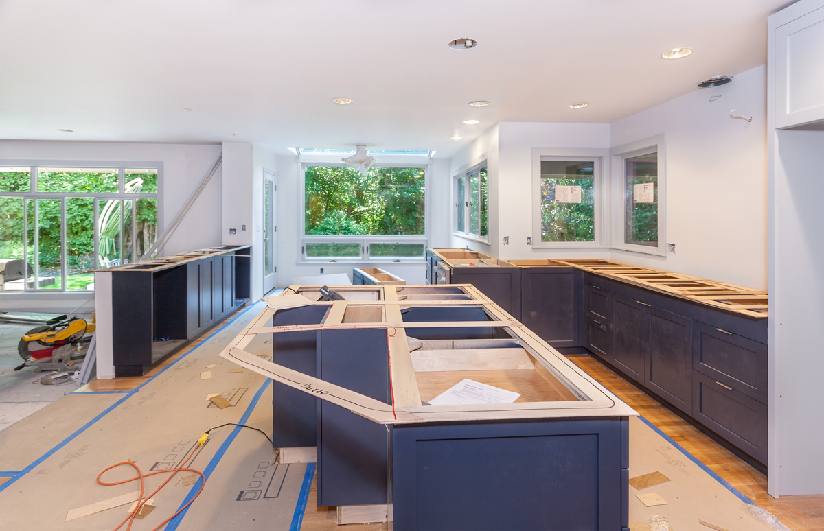 A kitchen with white walls being remodeled in a Seattle home.